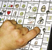 person using a communication board